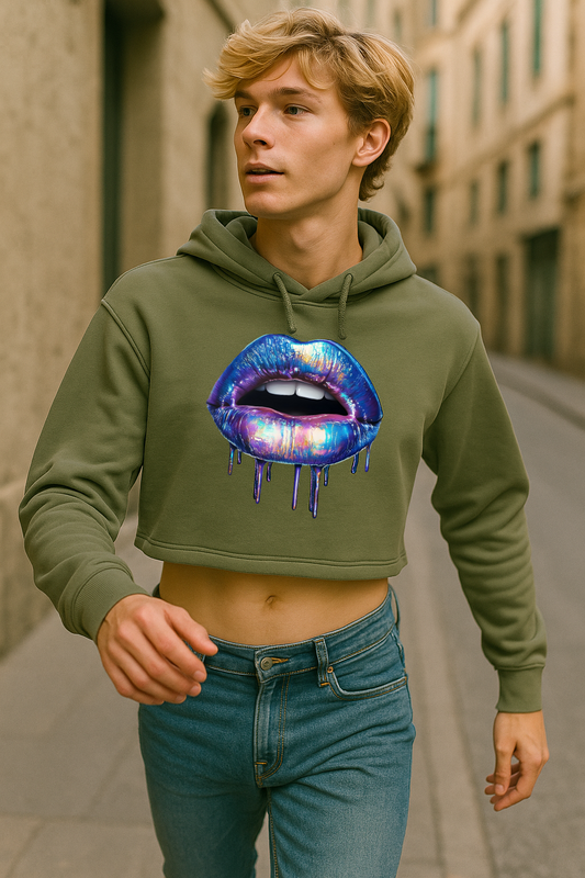 Person wearing a green hoodie with a colorful lip design on a city street.