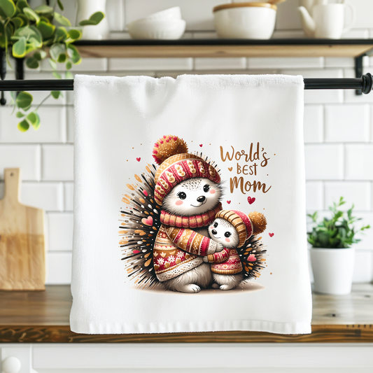 Kitchen towel with hedgehog design and 'World's Best Mom' text on a kitchen counter.