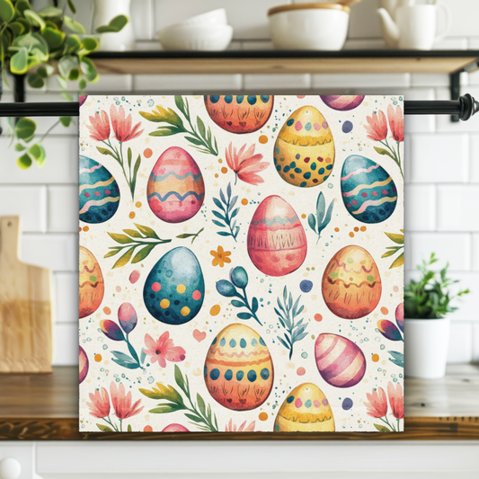Decorative kitchen towel with Easter egg and floral pattern hanging on a rack.