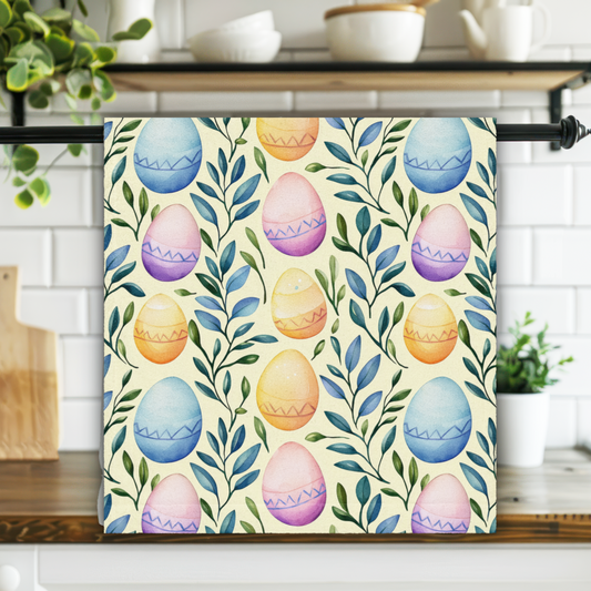 Kitchen towel with Easter egg pattern hanging on a rack in a kitchen.