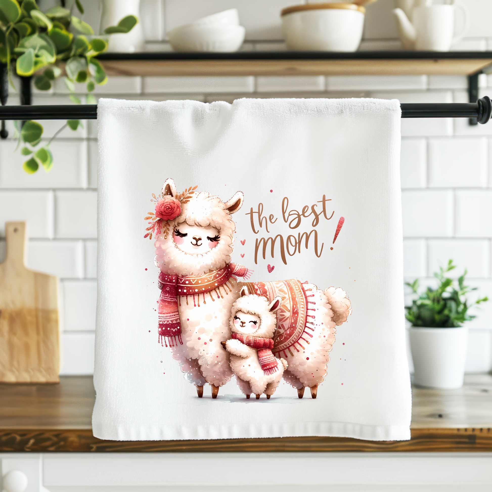 Kitchen towel with llama design and text on a kitchen counter