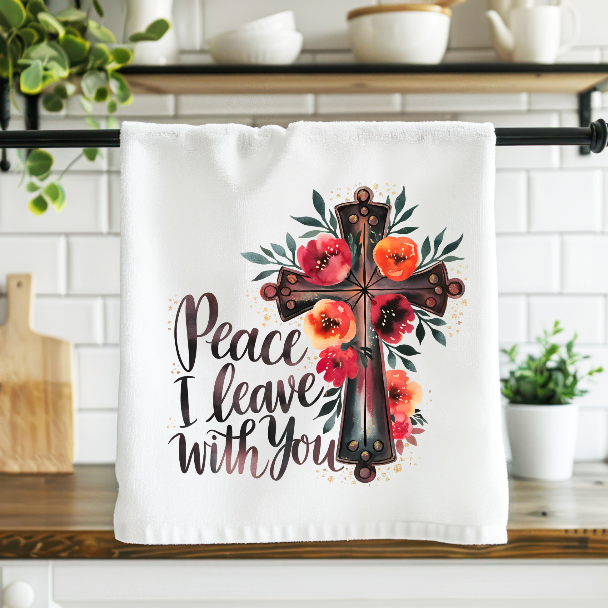 Decorative towel with cross and floral design on a kitchen counter
