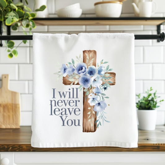 Kitchen towel with cross and floral design on a kitchen counter