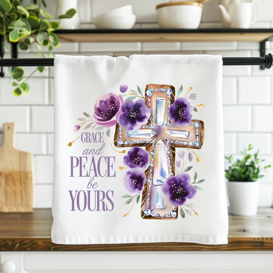Kitchen towel with cross and flowers design on a kitchen counter