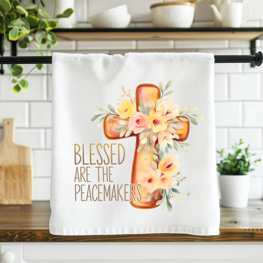 Decorative towel with cross and flowers design on a kitchen counter