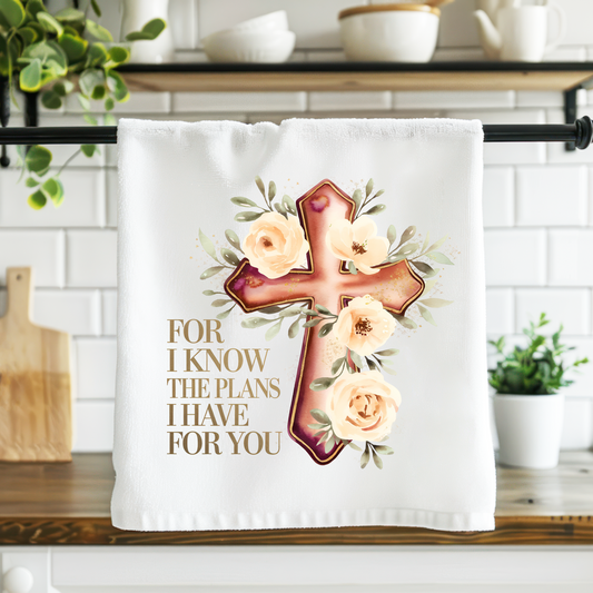 Decorative towel with cross and flowers design on a kitchen counter