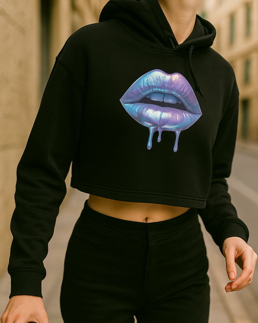 Black hoodie with a colorful lip design worn by a person outdoors.