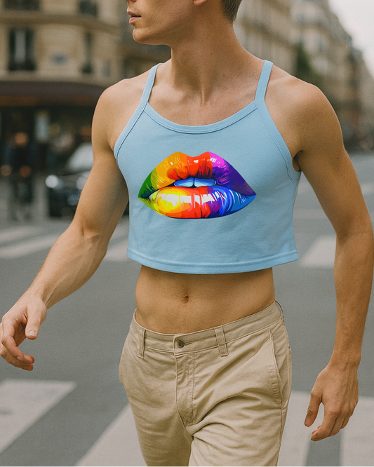 Person wearing a light blue tank top with a colorful lip design on a city street.