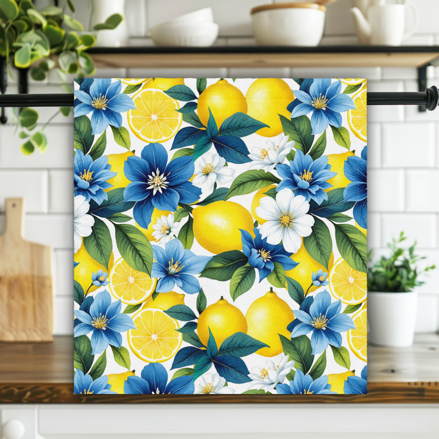 Colorful floral and lemon patterned towel hanging on a kitchen rack.