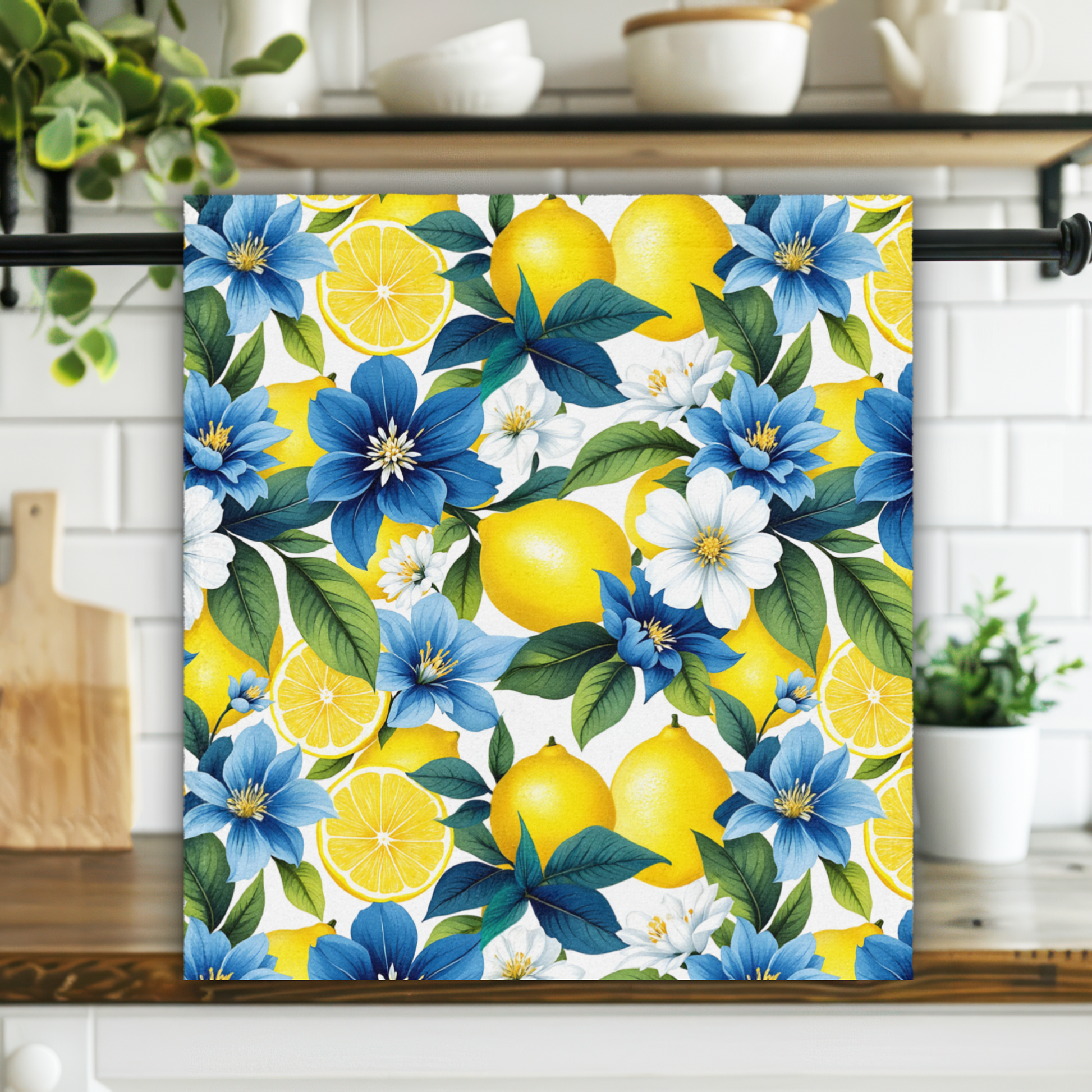 Colorful floral and lemon patterned towel hanging on a kitchen rack.