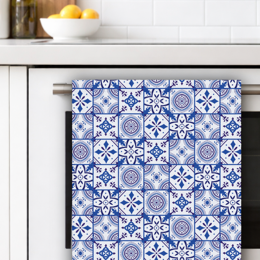 Blue and white patterned towel hanging on a kitchen rack.
