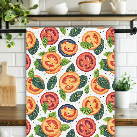 Towel with tomato pattern hanging on a rack in a kitchen